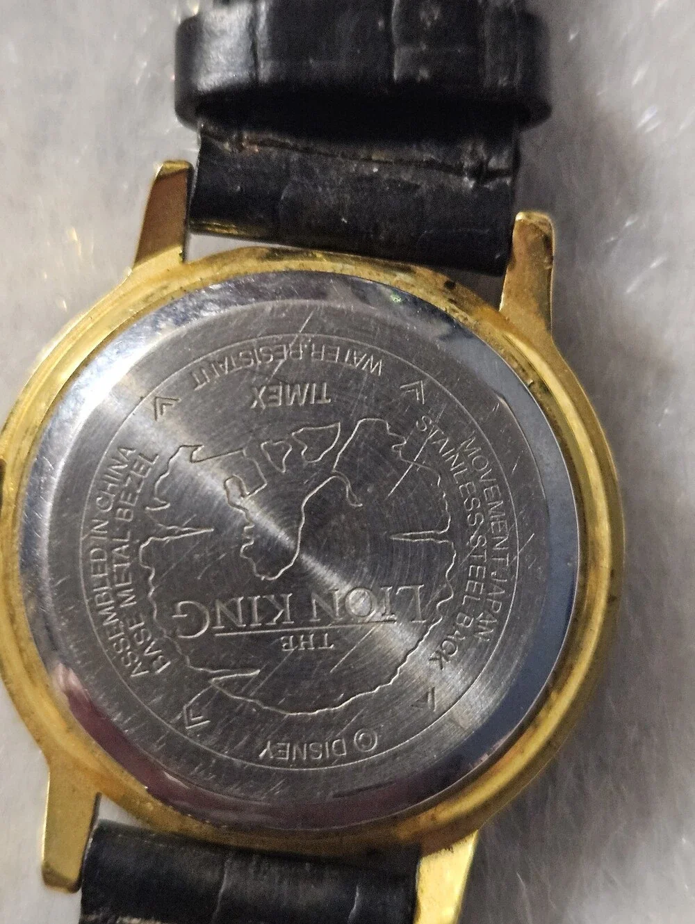 Lion King Timex Gold-Tone Case Watch with Black Leather Strap